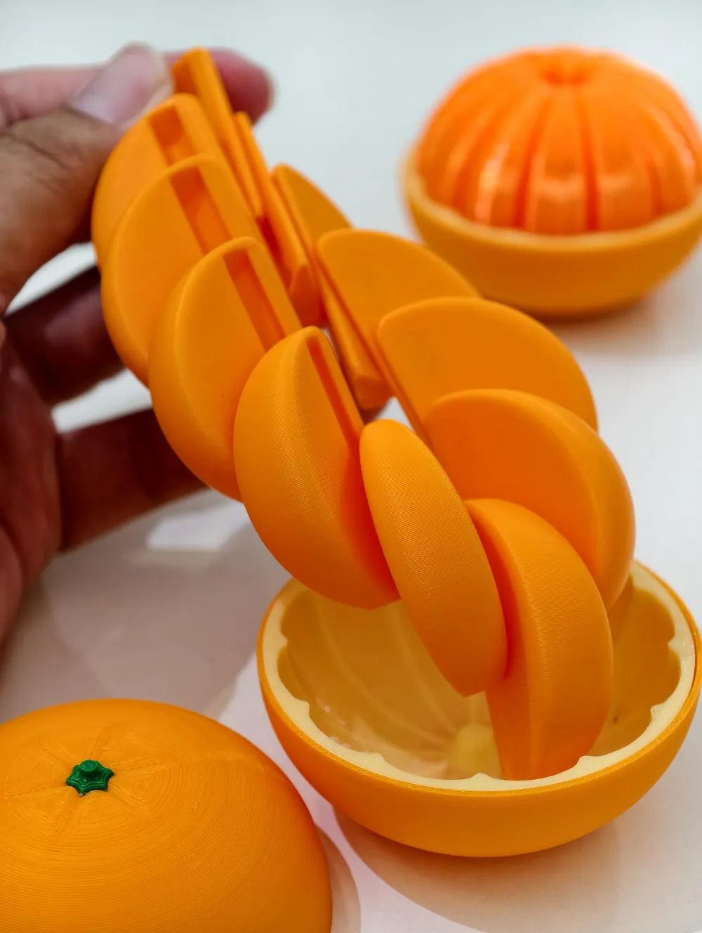 Tangerina Articulada Sensorial — gomos móveis impressos em 3D para brinquedo sensorial